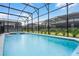 Large screened-in pool with an attached spa offers ample space for outdoor enjoyment and relaxation at 4149 Lana Ave, Davenport, FL 33897