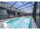 This home has a large, screened in pool and spa with a seating area to lounge around at 4149 Lana Ave, Davenport, FL 33897