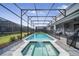 A luxurious screened-in pool and spa, perfect for swimming and relaxing in your private backyard oasis at 4149 Lana Ave, Davenport, FL 33897