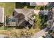 Aerial view of the house showing a screened-in pool and paver driveway at 4263 Lillian Hall Ln, Orlando, FL 32812