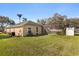 Expansive backyard with a screened-in pool and spa at 4263 Lillian Hall Ln, Orlando, FL 32812