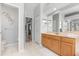 Bathroom features dual sinks, a toilet, and a doorway leading to another room at 4263 Lillian Hall Ln, Orlando, FL 32812