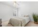 Cozy bedroom with neutral walls, carpeted floors, ceiling fan, and bright natural light at 4263 Lillian Hall Ln, Orlando, FL 32812