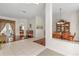 Bright dining room features a wooden table set, cabinet, decorative lighting, and transitions to other living areas at 4263 Lillian Hall Ln, Orlando, FL 32812