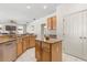 Updated kitchen with stainless appliances, granite counters, and an island for extra workspace at 4263 Lillian Hall Ln, Orlando, FL 32812