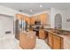 Well-lit kitchen with granite countertops and island and stainless-steel appliances at 4263 Lillian Hall Ln, Orlando, FL 32812