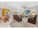 Spacious living room with plush seating, fireplace, neutral carpet, and sliding glass doors to the patio at 4263 Lillian Hall Ln, Orlando, FL 32812