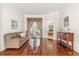 Cozy living room with hardwood floors, neutral tones, and a glass coffee table at 4263 Lillian Hall Ln, Orlando, FL 32812