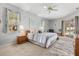 Bright main bedroom boasts a ceiling fan, plush carpeting, and access to outdoor living at 4263 Lillian Hall Ln, Orlando, FL 32812
