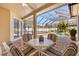 The screened lanai provides ample seating with a view of the refreshing swimming pool at 4263 Lillian Hall Ln, Orlando, FL 32812