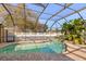 Screened-in pool with brick paver decking, spa, and screened enclosure at 4263 Lillian Hall Ln, Orlando, FL 32812