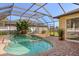 Relaxing screened-in pool area with brick pavers and lush landscaping at 4263 Lillian Hall Ln, Orlando, FL 32812