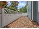 Fully fenced backyard with privacy fence and low maintenance wood chips at 4533 Burke St, Orlando, FL 32814