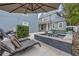 Backyard area with jacuzzi and lounge furniture at 4533 Burke St, Orlando, FL 32814