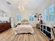 Bright bedroom features a spherical light fixture, hardwood floors, and shutters on the windows at 4533 Burke St, Orlando, FL 32814
