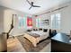 Bedroom with a sports theme featuring shutters on the windows and hardwood floors at 4533 Burke St, Orlando, FL 32814