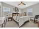 Bright bedroom featuring natural light, a ceiling fan, and decorative artwork at 4533 Burke St, Orlando, FL 32814