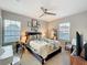 Cozy bedroom featuring a large bed, natural light, and stylish decorations at 4533 Burke St, Orlando, FL 32814