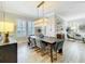 Elegant dining room with chandelier and adjacent living room at 4533 Burke St, Orlando, FL 32814