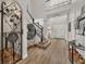 Elegant foyer showcasing staircase, decorative ironwork, and stylish entryway features at 4533 Burke St, Orlando, FL 32814