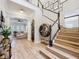 Grand foyer with staircase and view into the living room at 4533 Burke St, Orlando, FL 32814