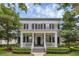 Charming two-story home with a welcoming front porch, manicured landscaping and a classic architectural style at 4533 Burke St, Orlando, FL 32814