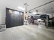 A spacious garage with a vehicle lift, ample storage, and a sleek, organized design at 4533 Burke St, Orlando, FL 32814
