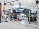 Well-equipped garage with car lift, offering secure vehicle storage and maintenance space at 4533 Burke St, Orlando, FL 32814