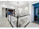 Upstairs hallway with carpet, white trim and doors and modern lighting fixtures at 4533 Burke St, Orlando, FL 32814