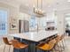 Elegant kitchen featuring a large island, white cabinets, and a stainless steel oven range at 4533 Burke St, Orlando, FL 32814