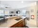 Modern kitchen with stainless steel appliances and a view into the living area at 4533 Burke St, Orlando, FL 32814