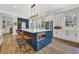 Bright, spacious kitchen with a large island, seating, and stainless steel appliances at 4533 Burke St, Orlando, FL 32814