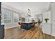 Spacious kitchen with large center island, bar seating, and hardwood floors at 4533 Burke St, Orlando, FL 32814