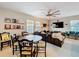 Spacious living room and dining table area, bathed in natural light from the surrounding windows at 4533 Burke St, Orlando, FL 32814