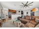 Open concept living room featuring a stylish ceiling fan and views of the kitchen at 4533 Burke St, Orlando, FL 32814