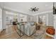 Open concept living space with stylish sectional sofa, hardwood floors, and seamless flow at 4533 Burke St, Orlando, FL 32814
