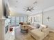 Comfortable living room with a ceiling fan, access to the patio and an open layout at 4533 Burke St, Orlando, FL 32814
