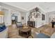 Open-concept living room with hardwood floors, stylish furniture, and a view of the staircase at 4533 Burke St, Orlando, FL 32814
