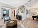 Elegant living area with wood floors, stylish furnishings, and open floor plan to the office at 4533 Burke St, Orlando, FL 32814