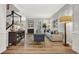 Spacious living room featuring hardwood floors, comfortable seating, and plenty of natural light at 4533 Burke St, Orlando, FL 32814