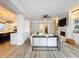 Stylish living room with fireplace, sofa and view into the kitchen at 4533 Burke St, Orlando, FL 32814