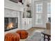 Cozy living room with fireplace and built-in shelves and cabinets at 4533 Burke St, Orlando, FL 32814
