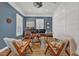 Elegant office with custom built-ins, hardwood floors, modern decor, and a comfortable seating area at 4533 Burke St, Orlando, FL 32814