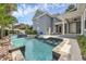 Beautiful outdoor pool with swim-up bar and lush landscaping at 4533 Burke St, Orlando, FL 32814