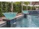Close-up of the water features surrounding the outdoor pool at 4533 Burke St, Orlando, FL 32814