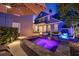 Stunning backyard featuring a pool, spa, fire pit, and a home exterior at twilight at 4533 Burke St, Orlando, FL 32814