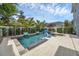 Inviting backyard pool and lounge area with lush greenery, a fire pit, and comfortable seating at 4533 Burke St, Orlando, FL 32814