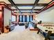 Finished home theater with coffered ceilings, projector, and comfortable seating at 4533 Burke St, Orlando, FL 32814