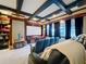 Finished home theater with coffered ceilings, projector, and comfortable seating at 4533 Burke St, Orlando, FL 32814