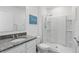 Modern bathroom featuring granite counters and a sleek glass enclosed shower at 5226 Mahogany Dr, Mount Dora, FL 32757